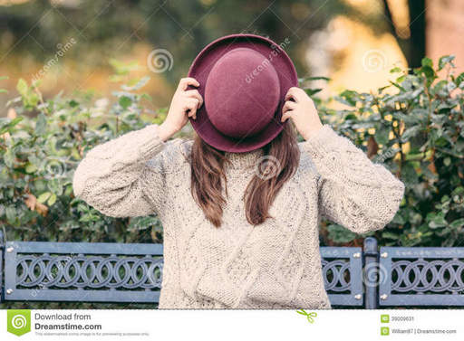 old-fashioned-woman-hiding-behind-hat-39009631.jpg