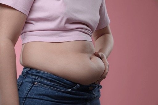 woman-touching-belly-fat-on-600nw-2460184153 (1).j